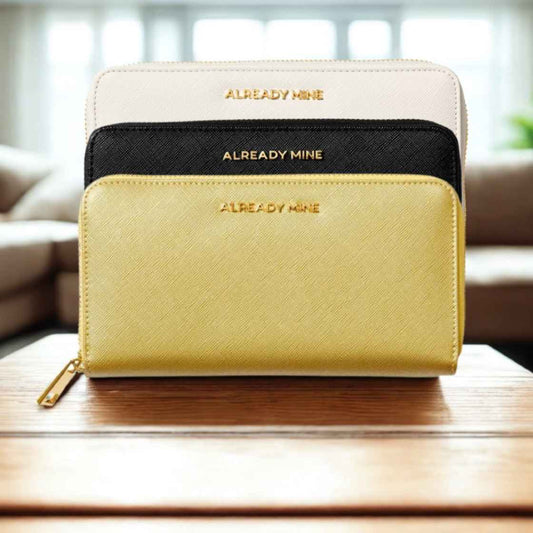 A selection of elegant vegan leather wallets for women, arranged with feng shui elements like crystals, plants, and gold accents for prosperity and balance.