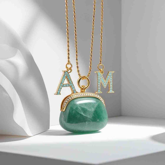 Green Aventurine Handbag Charm and amethyst crystal bag charms hanging on a vegan leather handbag for spiritual energy and protection