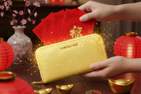 A person performing a Feng Shui wealth ritual with a luxury gold wallet and traditional red envelopes for Lunar New Year 2026.