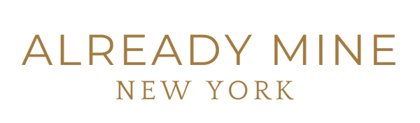 "ALREADY MINE" Transparent Logo – Sleek and minimalist brand logo symbolizing abundance, prosperity, and manifestation on alreadymineny.com.