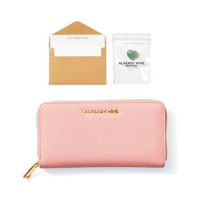 Beautifully packaged pink manifestation wallet, perfect as a gift for spiritual and abundance seekers.