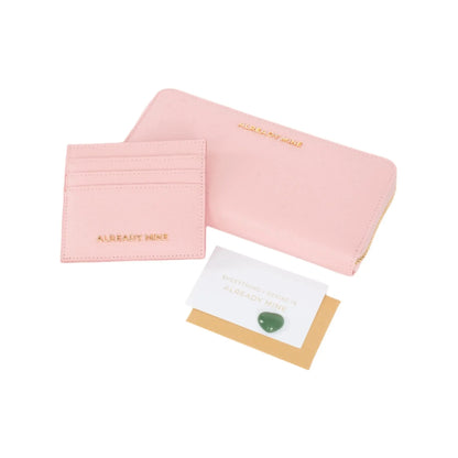 Front view of the Manifesting Pink Wallet Set, featuring a luxurious vegan leather wallet embossed with the affirmation 'ALREADY MINE' for financial abundance and prosperity.
