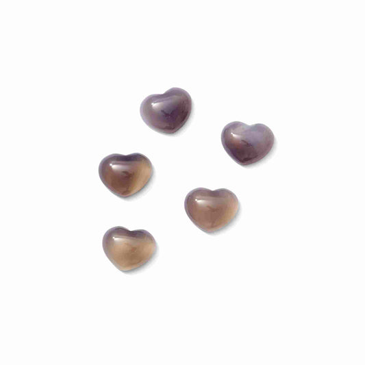 A polished Botswana Agate stone featuring unique natural banding in shades of grey, soft pink, and white.